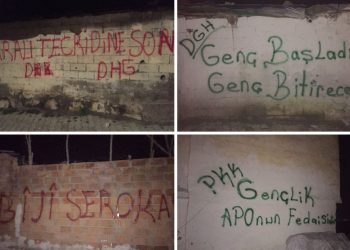 Ciwanên Amedê sloganan li ser diwara nivîsandin