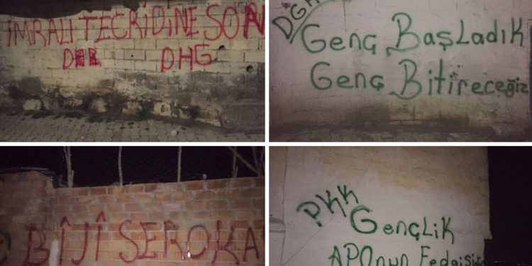 Ciwanên Amedê sloganan li ser diwara nivîsandin