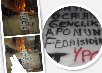 Milîsên YPC’ê yên Amedê, li dijî tecrîdê pankart aliqandin