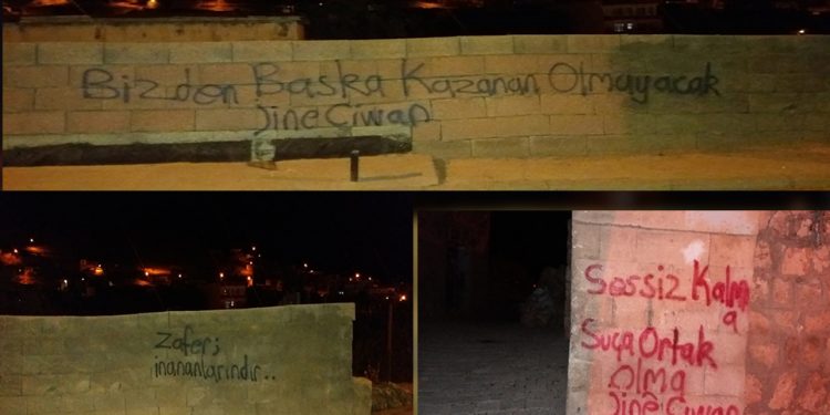 Genç kadınlardan duvar yazılama çalışması